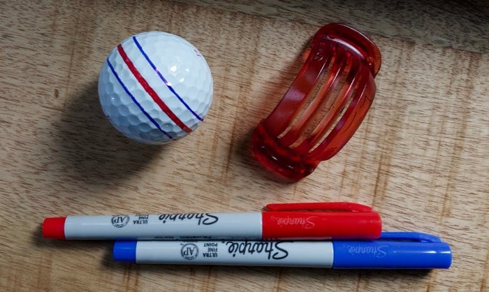 Why do people put Sharpie on golf balls?